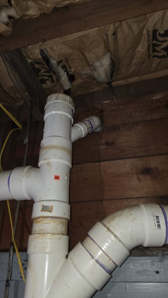 Insulated water lines running through an unfinished wall cavity on an A.W. Crooks job