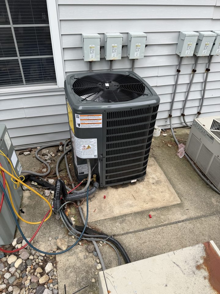 Outdoor AC condenser installed by A.W. Crooks