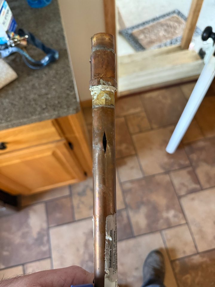 Burst copper water line repaired by A.W. Crooks