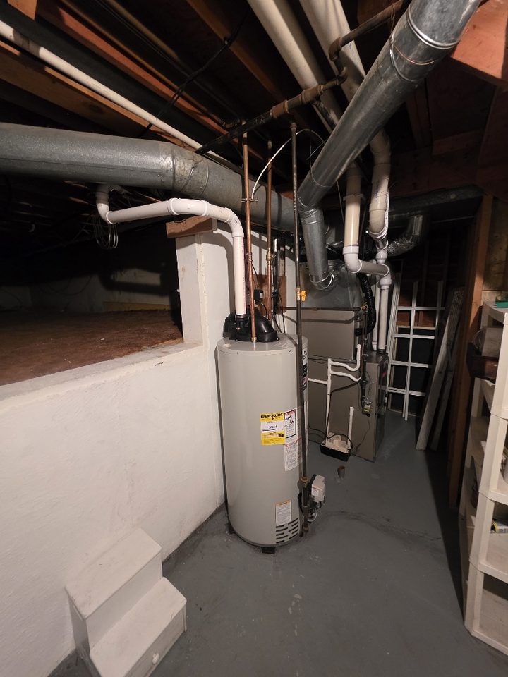A.W. Crooks water heater installation in a Battle Creek area basement