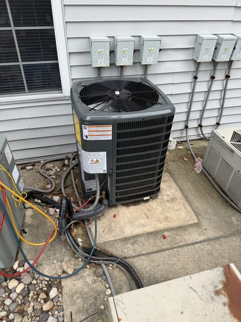 Outdoor AC condenser installed by A.W. Crooks