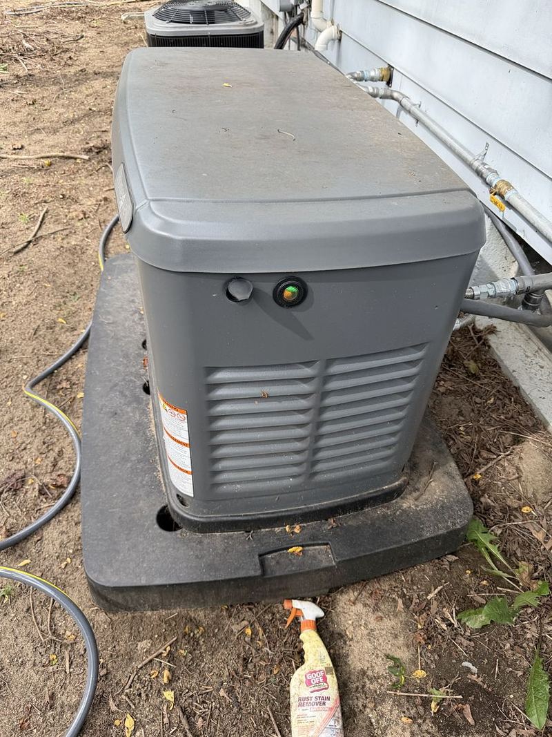 Standby generator on its pad outside a home